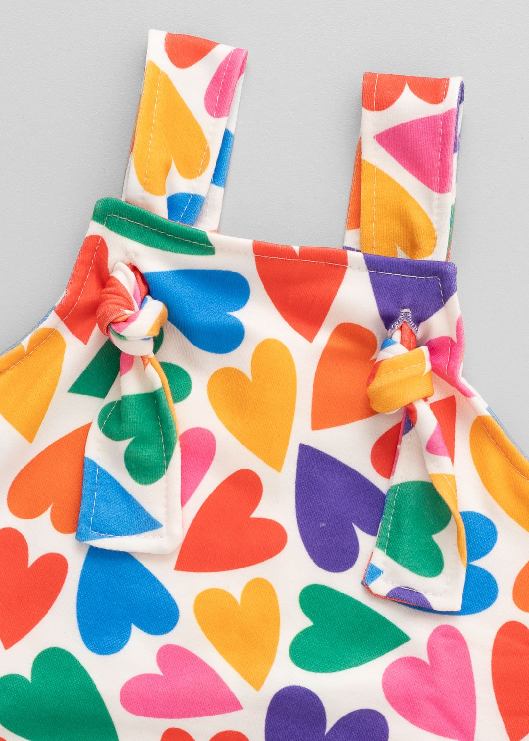 02 jardineira curta bebe doce coracao