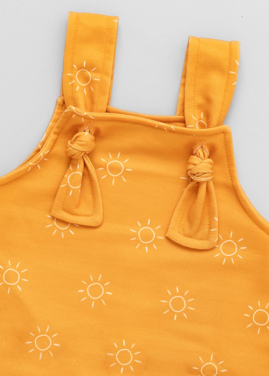 04 jardineira curta bebe minimalista sol